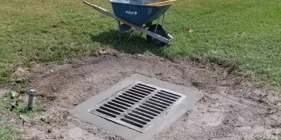 New drain grate set in concrete